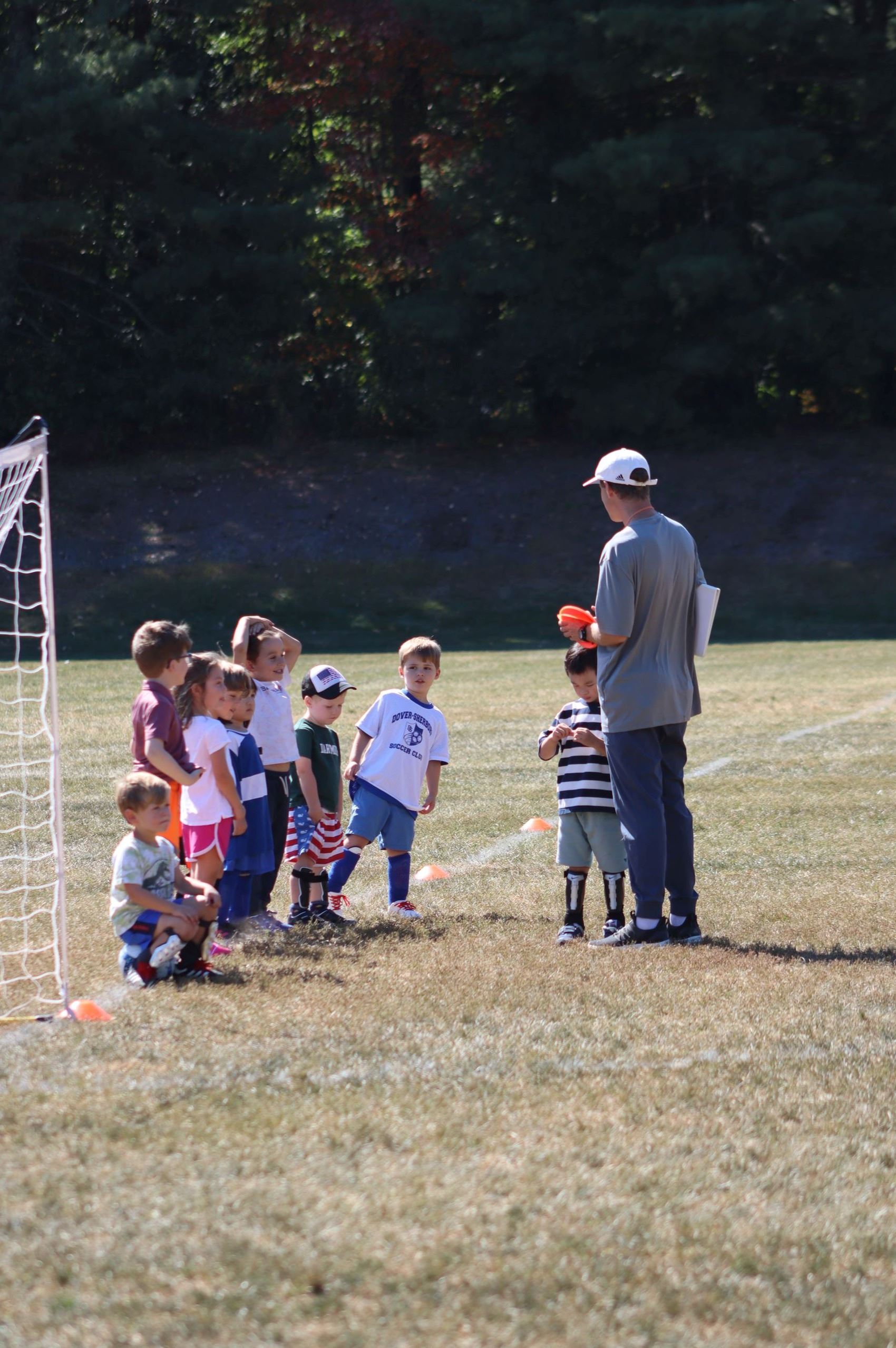 Photo of Soccer Instructor talking with the class