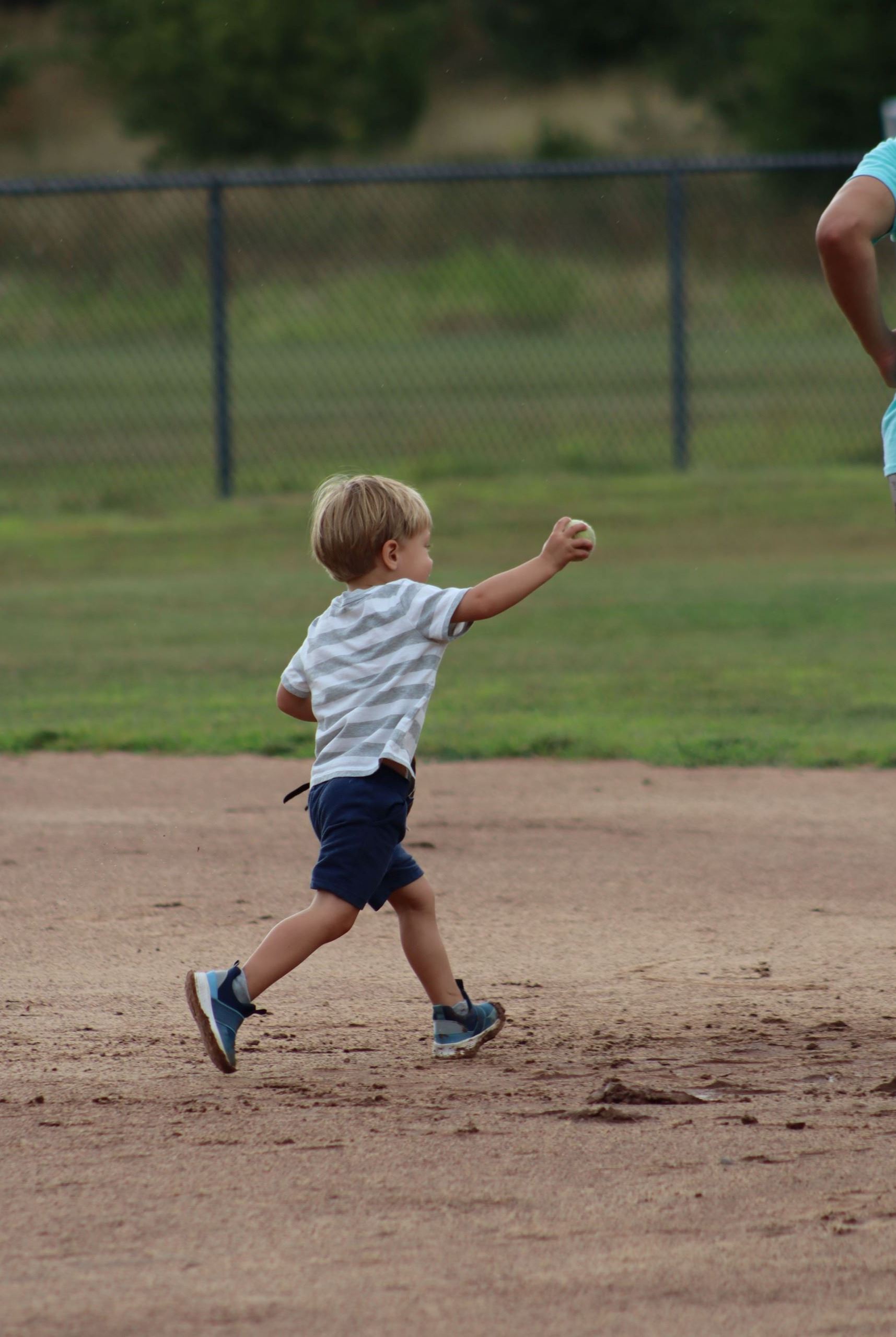 Photo of child running to tag 2nd base with the ball