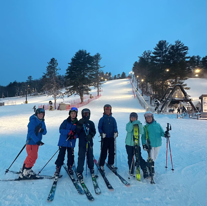 Photo of a group of children at the end of the slope at Nashoba Valley
